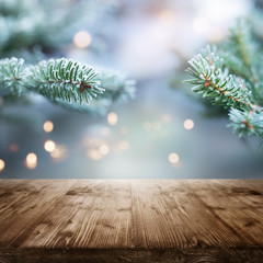 Fir branches in winter with table