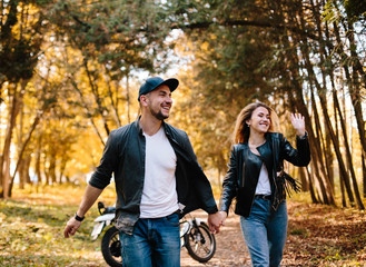 Naklejka premium young couple on motorcycle laugh