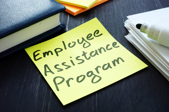 Employee Assistance Program EAP Sign And Pile Of Papers.