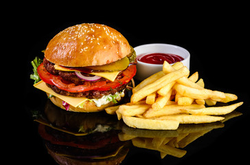 served burger with french fries on a black background