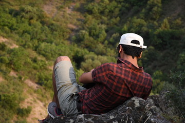 young man on a rock