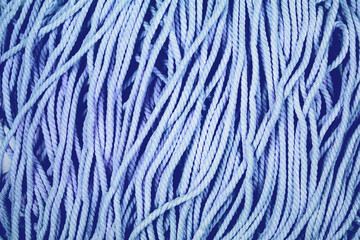 Minimalistic cotton blue rope background with texture and contrast.