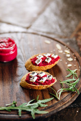 Canapes with horseradish and feta cheese sprinkled with sesame seeds. Appetizer for strong alcohol