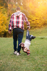 Father and son together in forest