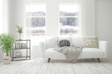 Stylish room in white color with sofa and winter landscape in window. Scandinavian interior design. 3D illustration