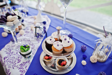 Dessert table of delicious sweets on wedding reception.