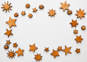 The beautiful christmas background with a lot of small wooden decorations on the white  desk.