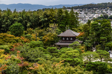 Kyoto cityscape with Ginkakuji Temple - Kyoto`s Silver Pavilion surrounded by colorful autumn foliage.