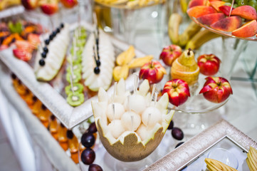 Dessert table of delicious fruits on wedding reception.
