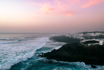 Sunset over smal village of el Golfo in Lanzarote, Canary Islands, Spain.