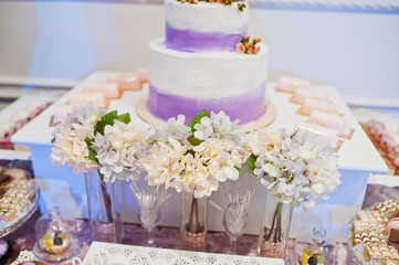 Dessert table of delicious sweets on wedding reception.
