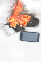 power supply burns with fire, phone on recharge, the fire in the apartment. cause of the fire...