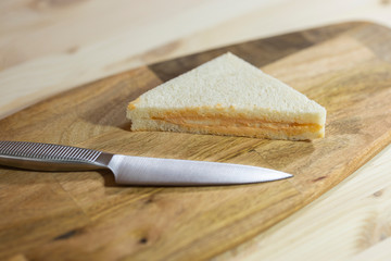 a slice of sandwich and sharp knife