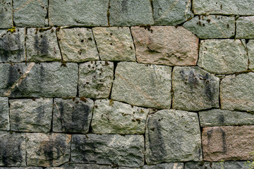 Skilled and beautifully crafted rock wall with neithly fitted stones
