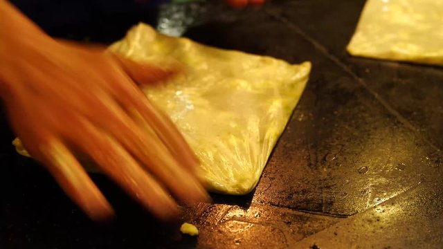 Chef preparing famous Turkish Gaziantep dessert named katmer.