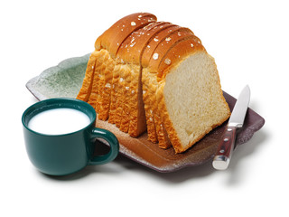 Milk and bread on white background