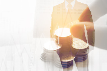 Double exposure.  row of coin with graph and business man. Finance and banking concept