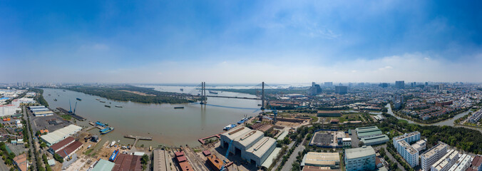 Phu My Bridge on a sunny day with blue sky with shipping on the Saigon River in Ho Chi Minh City, Vietnam