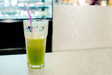 Matcha green tea latte beverage glass mug.