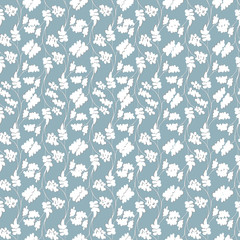 Light textile pattern of white leaves on a blue background. Seamless vintage style for fabric, tile and wallpaper on the wall.