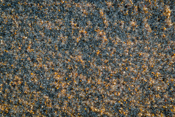 Macro of beach sand, to use as a natural background of rough pebbles.