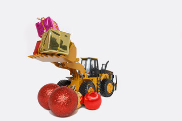 Christmas ornament and Wheel Loader model , Holiday celebration concept new year on white background