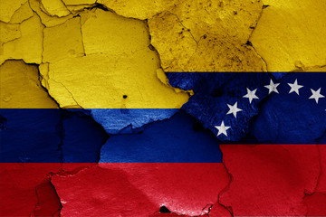 flags of Colombia and Venezuela painted on cracked wall