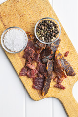 Beef jerky pieces. Dried beef meat.