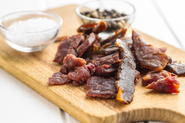 Beef jerky pieces. Dried beef meat.