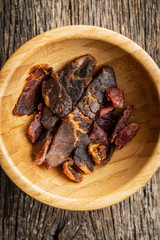Beef jerky pieces. Dried beef meat.