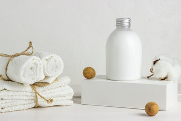 Fototapeta na wymiar Cosmetics and towels on a white background. Design. Minimal concept.