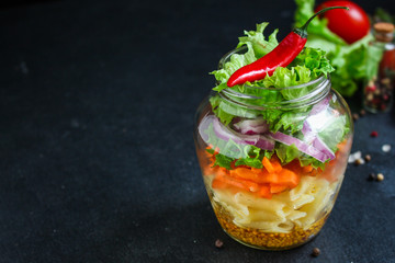 healthy salad in a jar (vegetable snack pasta salad) menu concept. food background. top view. copy space