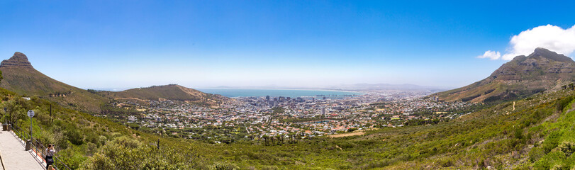 Fototapeta na wymiar Panoramic view over Cape Town, Devil's Peak, Lion's Head and Signal Hill on a sunny day, South Africa