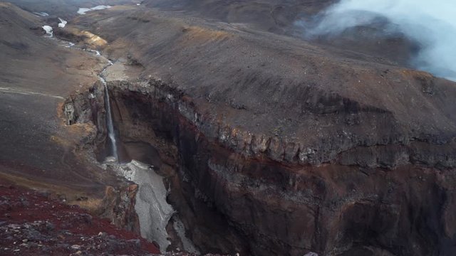 The waterfall and canyon Threat. Journey to Kamchatka Peninsula. The surrounding area of Mutnovsky volcano. Russia.