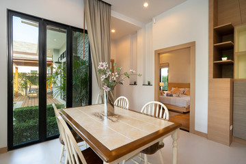 Dining table with pool view in luxury home