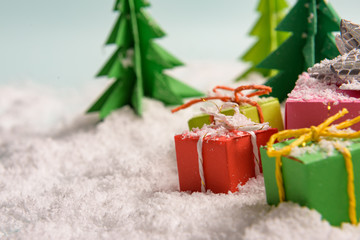 christmas presents nicely decorated with bows and feathers. view from above.