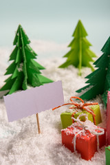 christmas presents nicely decorated with bows and feathers. view from above.