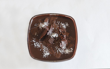 Supangle (pudding) dessert in glass bowl, on white background.