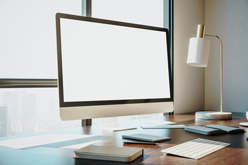 designer desktop with empty white computer screen