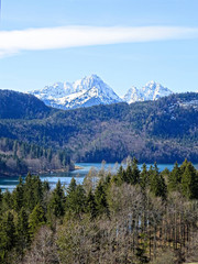 Fototapeta na wymiar Alpsee lake in surrounded with alpine mountains in Hohenschwangau, Bavaria Germany.