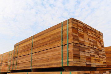 Pallet with a pile of lumber, packed for sale.