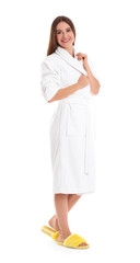 Young woman in bathrobe on white background