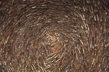 Detail of beautiful abstract textured backgrounds from plastic tapes. Selective focus. Golden twisted abstract.