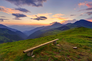 Bench in a very picturesque mountain location in beautiful Rodna mountains in Romania