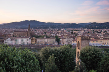 Fototapeta premium View over San Niccolò Tower and Basilica di Santa Croce at sunset. Piazzale Michelangelo, Florence, Italy. 