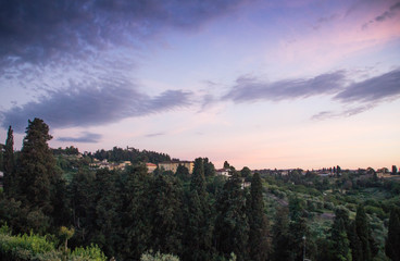 View over Florence hills at sunset from Piazzale Michelangelo, Florence, Italy.