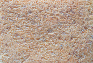Close-up texture of brown whole wheat bread background abstract pattern. Detail texture of pattern with free space copy for text.
