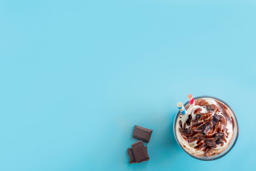 Fototapeta na wymiar Chocolate smoothie on fluor color background