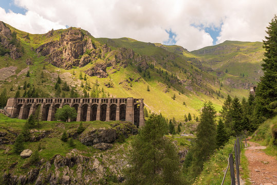Morning view of the Gleno dam from the path that arrives in the Val di Scalve