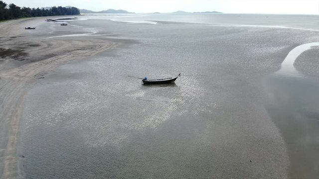 Aerial Shot Revolving boat on the beach from Thailand